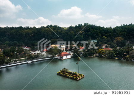 Skyline aerial view of Kandy lake city and famous landmark Sri Dalada Maligawa, Sacred Tooth Relic The Temple in Sri Lanka. Skyline aerial view of Kandy lake city and famous landmark Sri Dalada Maligawa, Sacred Tooth Relic The Temple in Sri Lanka. 91665955