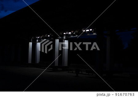 Empty bus stop in the dark with lantern 91670763