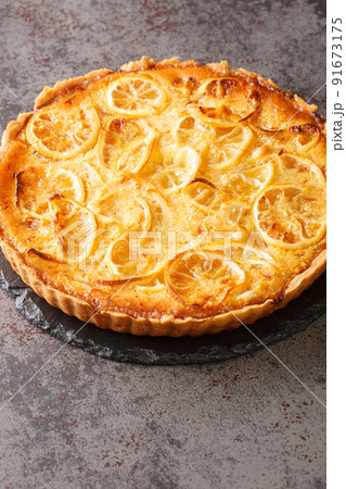 Shaker Lemon Pie is a bright citrus pie bursting with lemony goodness closeup in the plate. Vertical Shaker Lemon Pie is a bright citrus pie bursting with lemony goodness closeup in the plate. Vertical 91673175