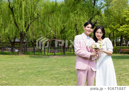 Korean Asian couple self small wedding concept in spring Korean Asian couple self small wedding concept in spring 91675887