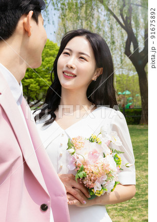Korean Asian couple self small wedding concept in spring Korean Asian couple self small wedding concept in spring 91675892