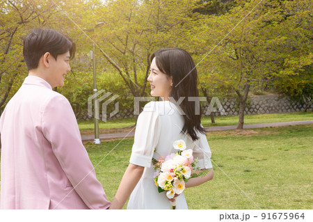 Korean Asian couple self small wedding concept in spring Korean Asian couple self small wedding concept in spring 91675964