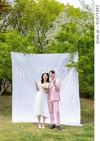 Korean Asian couple self small wedding concept in spring Korean Asian couple self small wedding concept in spring 91675965