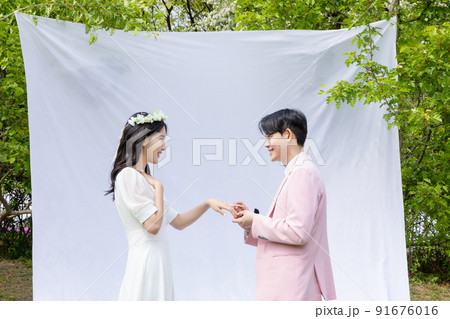 Korean Asian couple self small wedding concept in spring_propose Korean Asian couple self small wedding concept in spring_propose 91676016