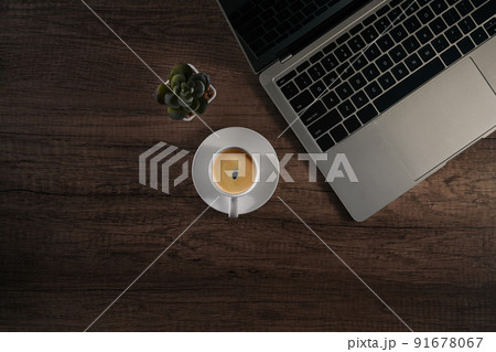 Top view laptop computer, coffee cup and succulent plant wooden table Top view laptop computer, coffee cup and succulent plant wooden table 91678067