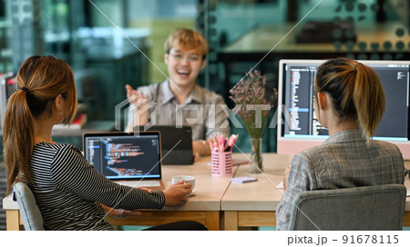 Group of software developers brainstorming and discussion for developing software applications at modern office 91678115