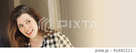 Banner young woman shows her gray hair roots. Early aging concept with copy space Banner young woman shows her gray hair roots. Early aging concept with copy space 91682221