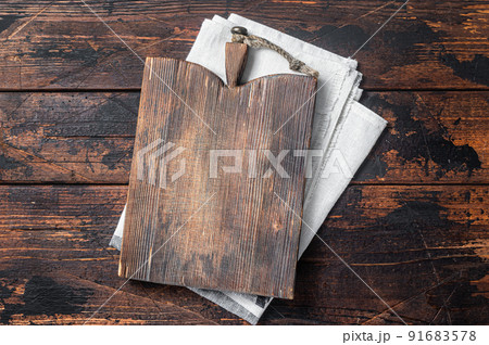 Directly Above view Of Cutting Board On dark Wooden Table. Wooden background. Top view. Copy space Directly Above view Of Cutting Board On dark Wooden Table. Wooden background. Top view. Copy space 91683578