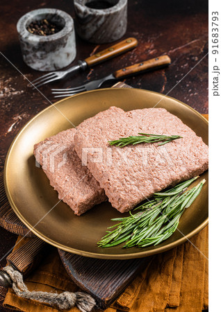 Fresh Veggie mince meat, raw plant based meat with rosemary. Dark background. Top view 91683793