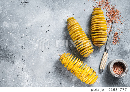 Cooking Tornado or Twist potato fries. Gray background. Top view. Copy space Cooking Tornado or Twist potato fries. Gray background. Top view. Copy space 91684777