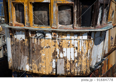 Closeup View of Old Decaying Fishing Boat at a Harbour Location 91684778