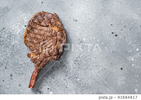 Grilled Beef Steak Tomahawk, Rib eye. Gray background. Top view. Copy space Grilled Beef Steak Tomahawk, Rib eye. Gray background. Top view. Copy space 91684817