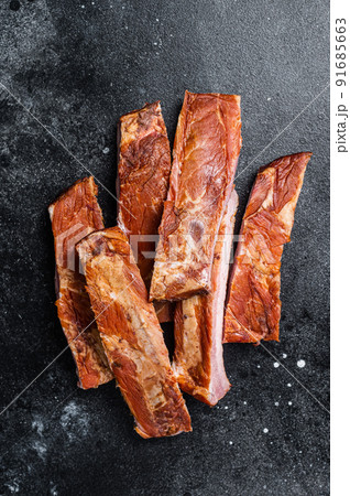 Sliced Smoked BBQ Pork Ribs. Black background. Top view 91685663