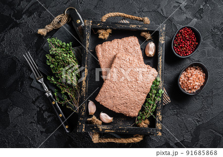 Raw plant based vegan mince meat with herbs. Black background. Top view 91685868