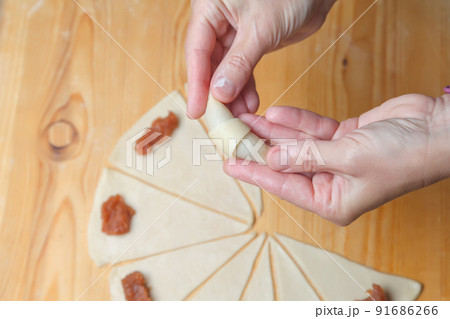 Cooking mini croissants in the kitchen at home 91686266
