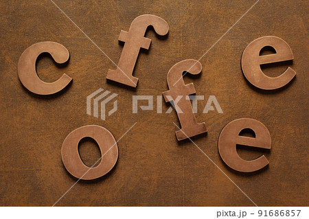 Coffee letters at abstract background texture Coffee letters at abstract background texture 91686857