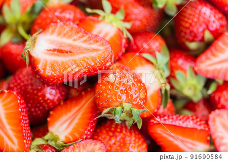 Macro photo of little snail on top of red appetizing strawberry Macro photo of little snail on top of red appetizing strawberry 91690584