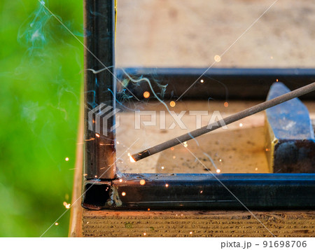 The tip of a hot electrode for electric arc welding. The tip of a hot electrode for electric arc welding. 91698706