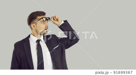 Amazed businessman shocked by business deal 91699367