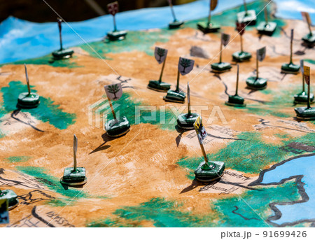 reproduction of an ancient medieval map with flags to mark the war disposition reproduction of an ancient medieval map with flags to mark the war disposition 91699426