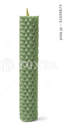 Front view of green beeswax honeycomb candle 91699674