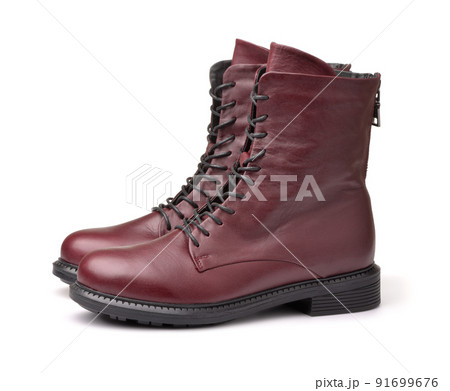 Side view of maroon leather winter ladies boots Side view of maroon leather winter ladies boots 91699676