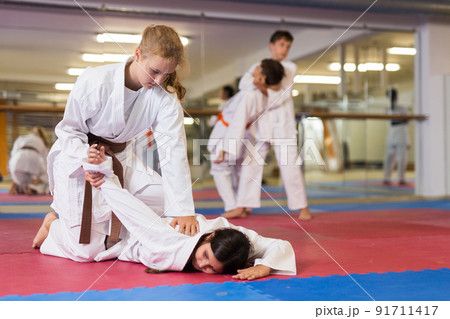 Kids in kimono training in gym Kids in kimono training in gym 91711417