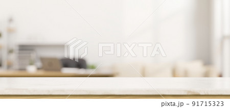 Copy space on empty white tabletop over blurred modern living room in the background. Copy space on empty white tabletop over blurred modern living room in the background. 91715323