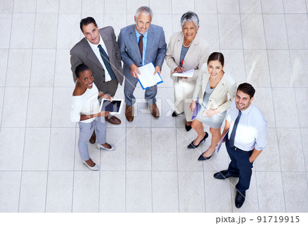 They know what theyre doing. Portrait of a group of businesspeople holding paperwork and their digital devices. 91719915