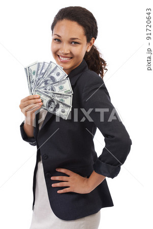 Success is finally here. Studio portrait of an attractive young businesswoman holding fanned-out money isolated on white. 91720643