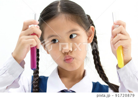 Happy Asian student girl making science experiments at school labs. Happy Asian student girl making science experiments at school labs. 91720879
