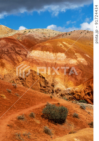 Colorful hills in Altai Republic, named Mars 1. Nature environment background. Natural colored texture of sandstone Martian landscape in Altai Mountains. Colorful hills in Altai Republic, named Mars 1. Nature environment background. Natural colored texture of sandstone Martian landscape in Altai Mountains. 91724434