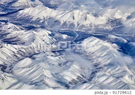 Mountain landscape, view from an airplane, Snowy panorama Mountain landscape, view from an airplane, Snowy panorama 91729612