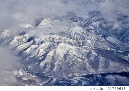 Mountain landscape, view from an airplane, Snowy panorama Mountain landscape, view from an airplane, Snowy panorama 91729613
