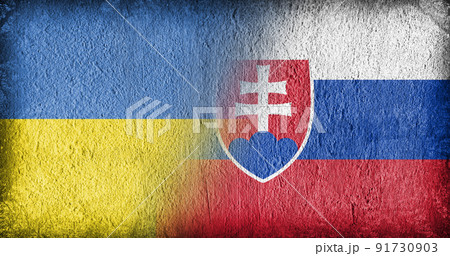 Ukrainian and Slovakian flag on concrete 91730903