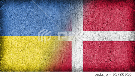Ukrainian and Danish flag on concrete Ukrainian and Danish flag on concrete 91730910