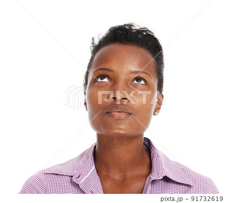 Looking for a sign. Pretty African woman gazing upwards into copyspace, isolated on white. 91732619