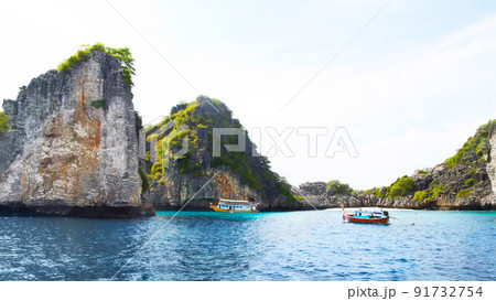 Cliffs of paradise. Panoramic view of beautiful islands with rocky cliffs, boats passing by - Copyspace. Cliffs of paradise. Panoramic view of beautiful islands with rocky cliffs, boats passing by - Copyspace. 91732754
