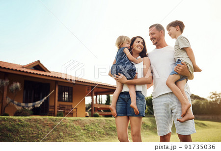 Were just so lucky to have each other. Shot of a happy family bonding together outdoors. 91735036