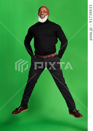 Never stop living your best life. Studio shot of a senior man posing against a green background. 91736635