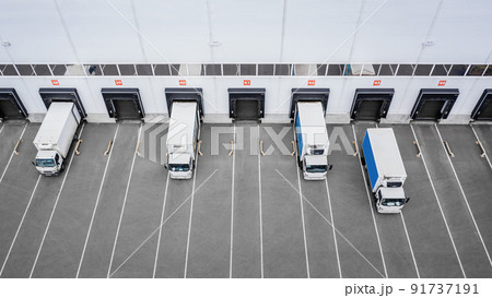 Small trucks unloading in distribution hub. Aerial view 91737191
