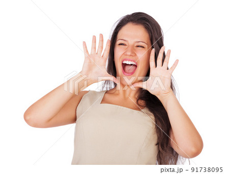 Listen up. A young businesswoman smiling and shouting while isolated on white. 91738095