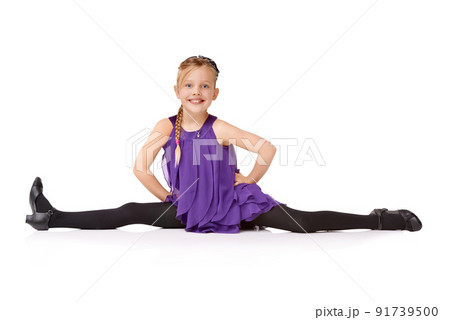 Ta-daa. Full length shot of a young girl doing the splits isolated on white. Ta-daa. Full length shot of a young girl doing the splits isolated on white. 91739500