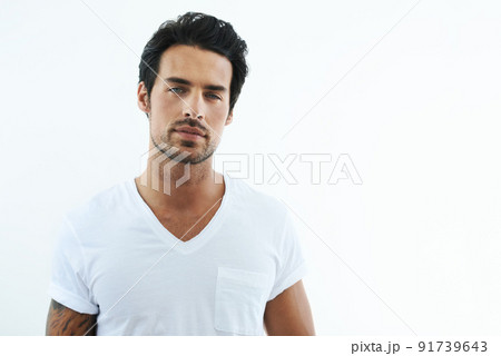 I make this shirt look good. Shot of handsome man wearing a white t-shirt. 91739643