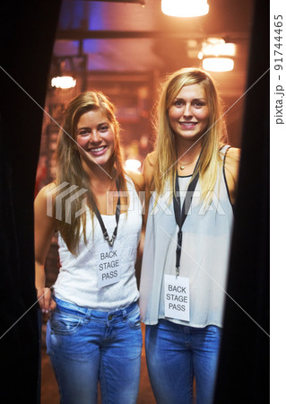 Two young women with backstage passes at a concert. This concert was created for the sole purpose of this photo shoot, featuring 300 models and 3 live bands. All people in this shoot are model Two young women with backstage passes at a concert. This concert was created for the sole purpose of this photo shoot, featuring 300 models and 3 live bands. All people in this shoot are model 91744465