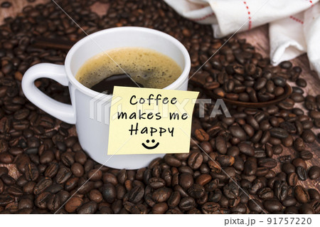 Motivational quote on yellow sticky note with coffee on wood background. 91757220