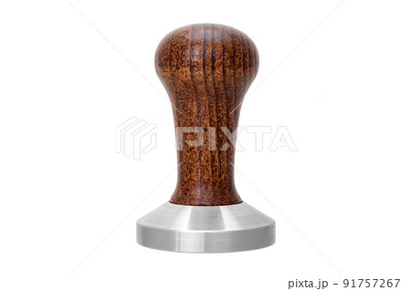 Barista tool for pressing coffee tamper with brown wooden handle, object isolated on white. Barman equipment for pressing down ground coffee, tamper for making espresso coffee front view, nobody. Barista tool for pressing coffee tamper with brown wooden handle, object isolated on white. Barman equipment for pressing down ground coffee, tamper for making espresso coffee front view, nobody. 91757267