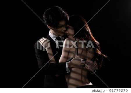 Young Couple embraces with love, business man try to untie lingeries bra of girlfriend 91775279