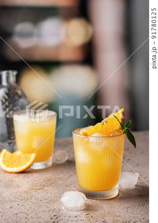 Orange and mint cocktails, soft drinks on bar with text space Orange and mint cocktails, soft drinks on bar with text space 91780125