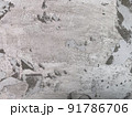 Old gray concrete wall with peeling surface. Grey concrete wall texture. 91786706
